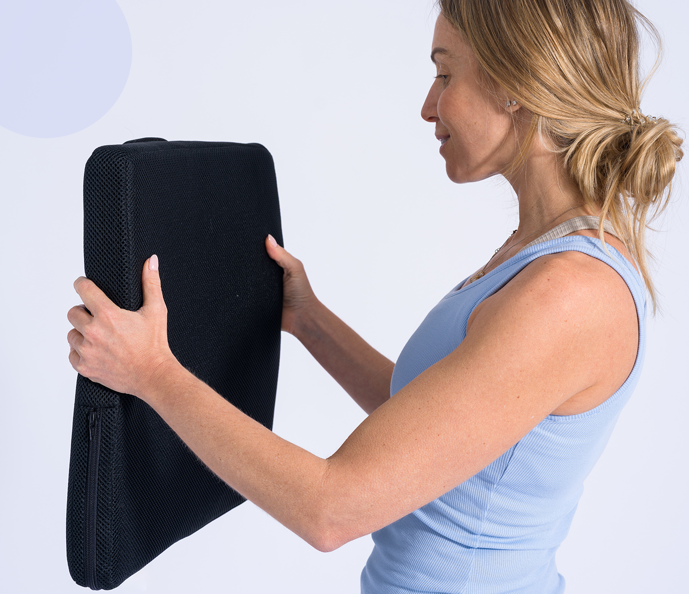 woman holding the seat topper