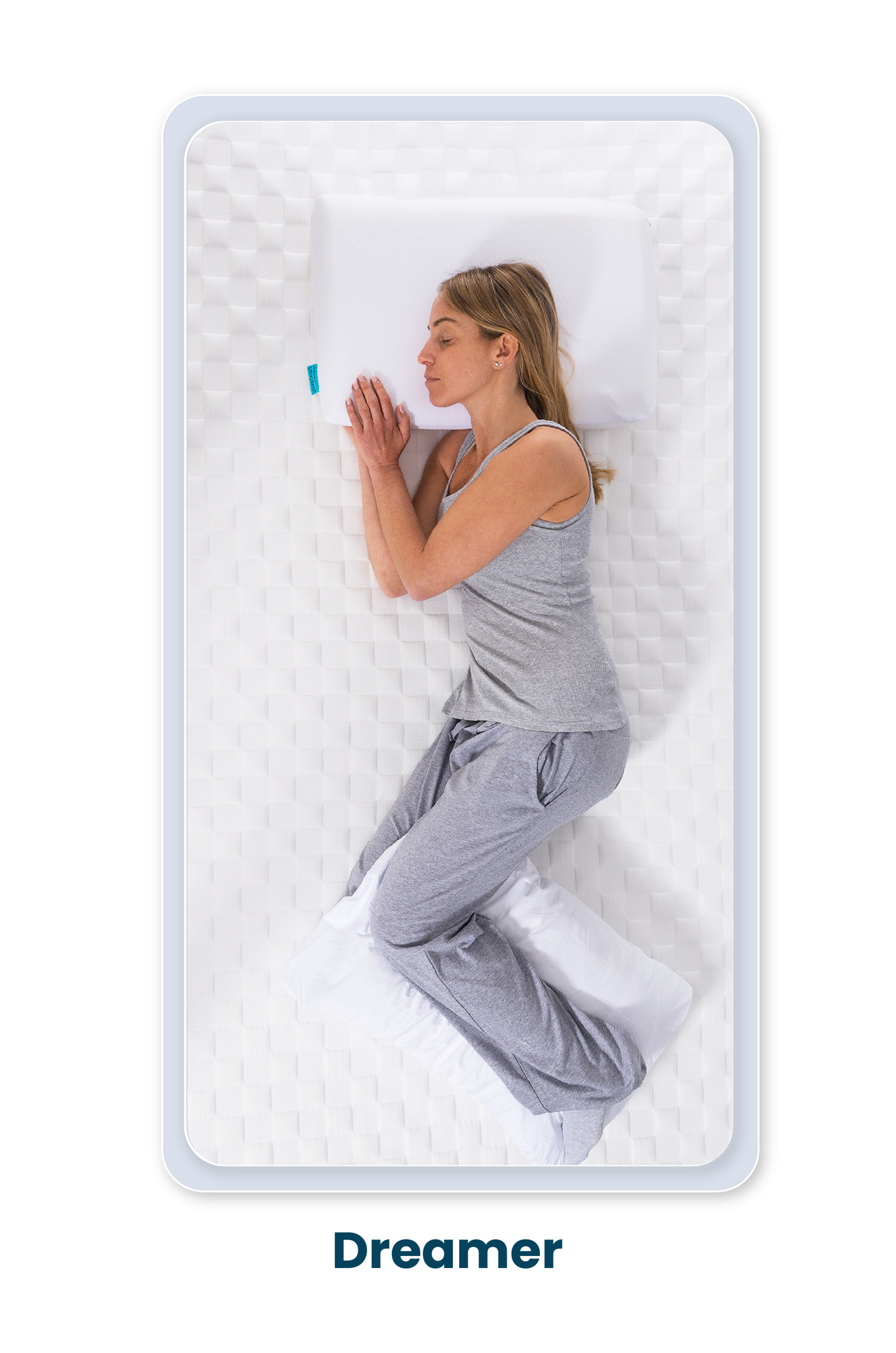 Woman lying on a pillow with 'Dreamer' branding